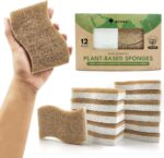 Twelve S-shaped AIRNEX Natural Kitchen Sponges, made from khaki cellulose and coconut, stacked neatly.