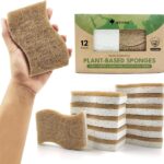 Twelve S-shaped AIRNEX Natural Kitchen Sponges, made from khaki cellulose and coconut, stacked neatly.