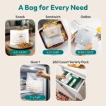 A variety pack of FEBU compostable food storage bags, including snack, sandwich, quart, and gallon sizes, neatly arranged.