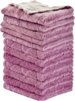 A stack of 12 purple coral fleece kitchen towels, neatly folded, showcasing their soft texture and rectangular shape.