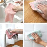 A stack of 12 coral velvet kitchen towels, neatly folded, showcasing their soft texture and absorbent material.