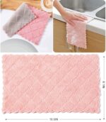A stack of 12 coral velvet kitchen towels, neatly folded, showcasing their soft texture and absorbent material.