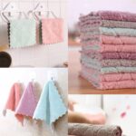 A stack of 12 coral velvet kitchen towels, neatly folded, showcasing their soft texture and absorbent material.
