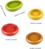 Set of colorful silicone food pods in green, red, yellow, and brown, holding various fruits and vegetables.